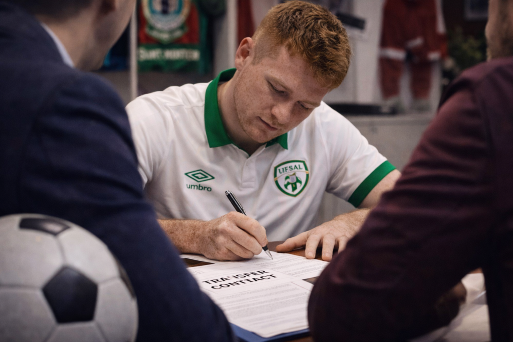 A player is signing a contract to transfer to another football club